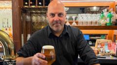 Barman raises a glass after £3.5m Omaze house win